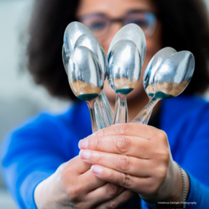 Do you want to fit in or be different - lady holding spoons