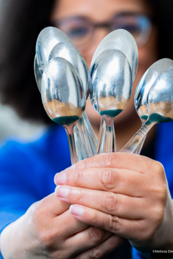 Do you want to fit in or be different - lady holding spoons