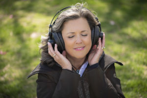 Lady listening to music.